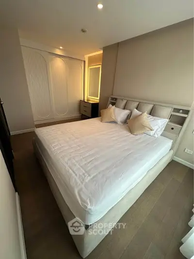 Luxurious bedroom with elegant design and cozy ambiance, featuring a plush bed and stylish decor.