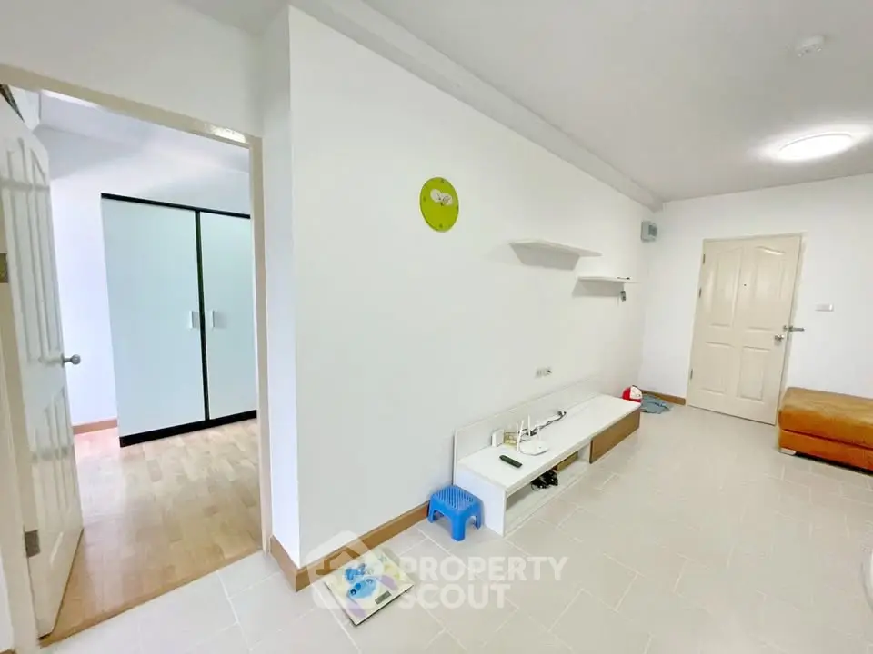 Spacious living area with modern minimalist design and ample natural light.