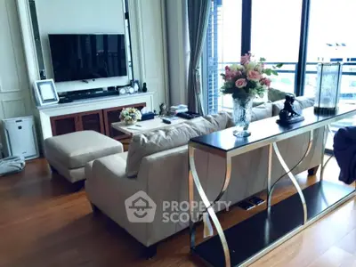 Luxurious living room with elegant decor and large windows offering stunning views.