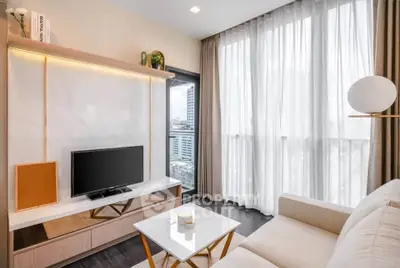 Modern living room with large window and stylish decor in urban apartment.