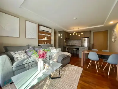 Stylish modern living room with open kitchen and elegant decor