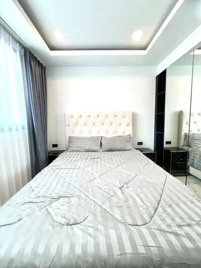 Luxurious bedroom with elegant decor and plush bedding