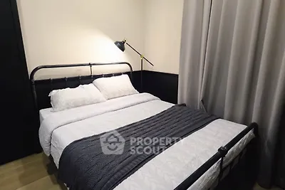 Cozy bedroom with modern metal bed frame and elegant lighting