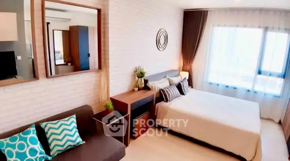 Modern bedroom with stylish decor and large window for natural light