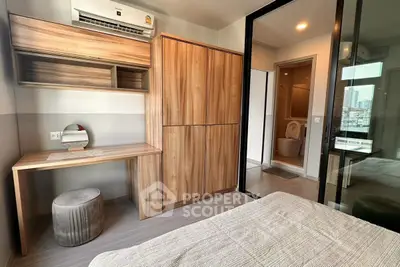 Modern bedroom with wooden furniture and ensuite bathroom in urban apartment