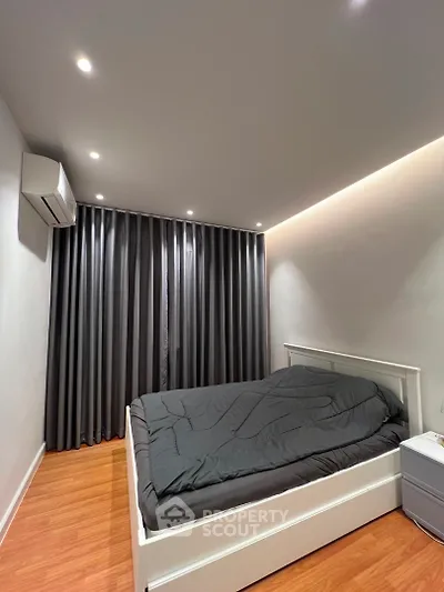 Modern bedroom with sleek design and cozy atmosphere