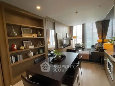 Modern open-plan living and dining area with stylish decor and natural light.