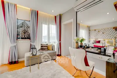 Luxurious bedroom with elegant decor and natural light, featuring a stylish vanity and plush seating area.