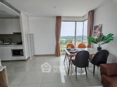 Modern dining area with stunning city view and sleek kitchen design