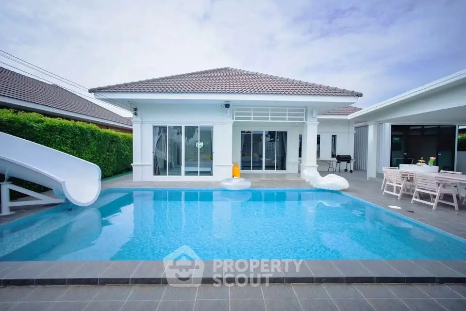 Luxurious villa with private pool and slide, perfect for family entertainment.