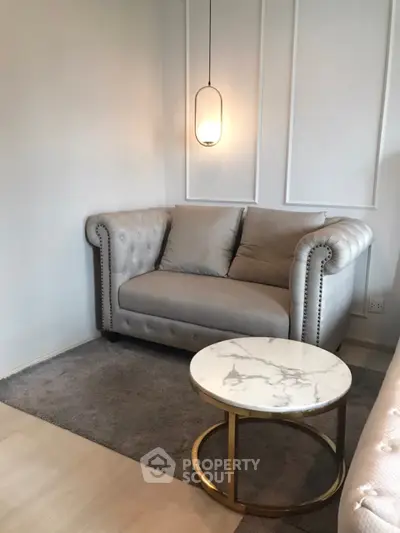 Elegant living room with plush sofa and chic marble coffee table