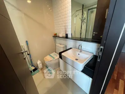 Modern bathroom with sleek fixtures and stylish design in a contemporary apartment.