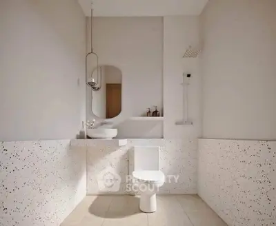Modern minimalist bathroom with terrazzo walls and sleek fixtures