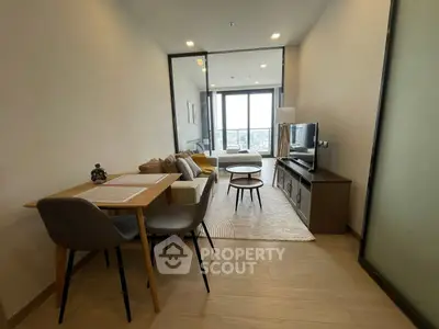 Modern living room with stylish furniture and city view, perfect for urban living.