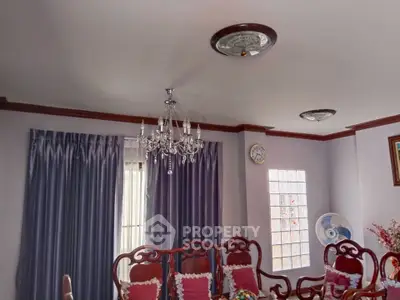 Elegant living room with chandelier and classic wooden furniture