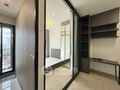 Modern apartment with sleek bedroom and balcony view