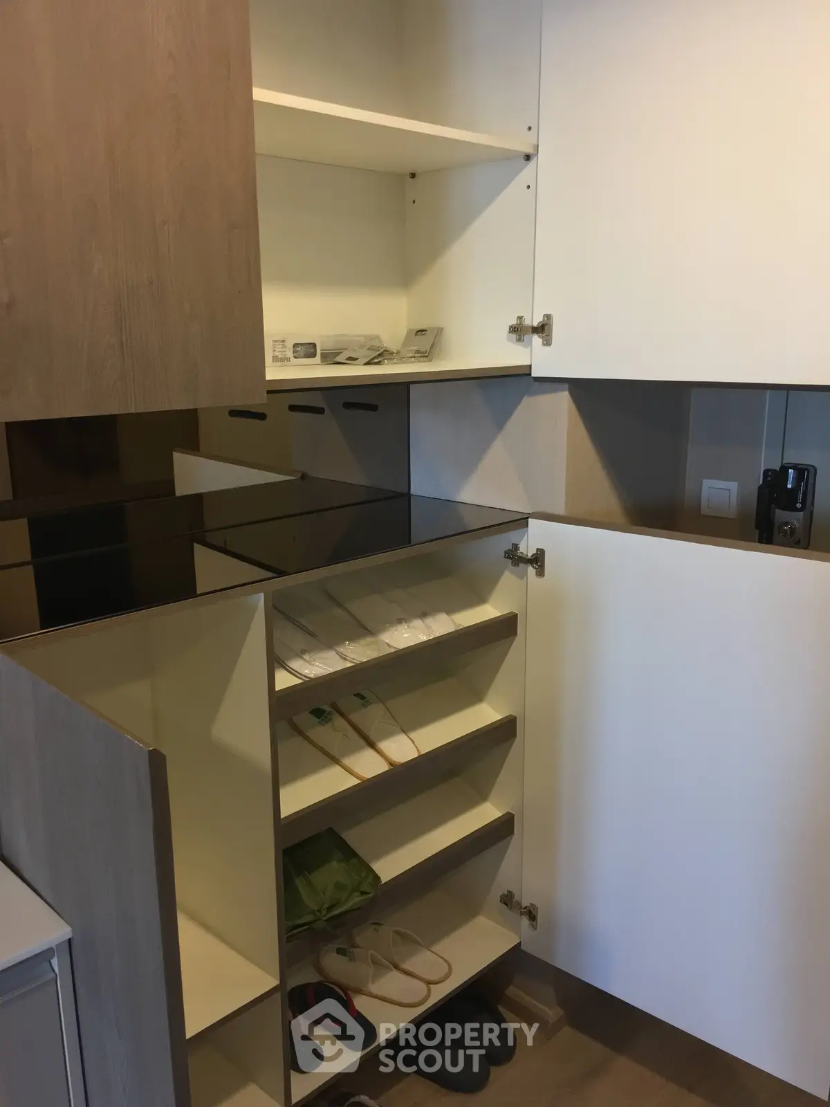 Modern kitchen storage cabinets with open shelving and sleek design