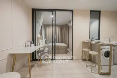 Modern open-plan apartment with stylish decor and in-unit washing machine