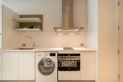 Modern kitchen with integrated appliances and sleek design
