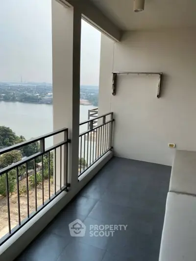 Spacious balcony with stunning river view in modern apartment