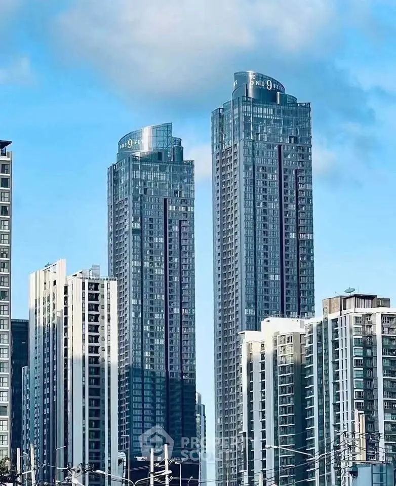 Stunning skyline view of modern high-rise residential towers against a clear blue sky.