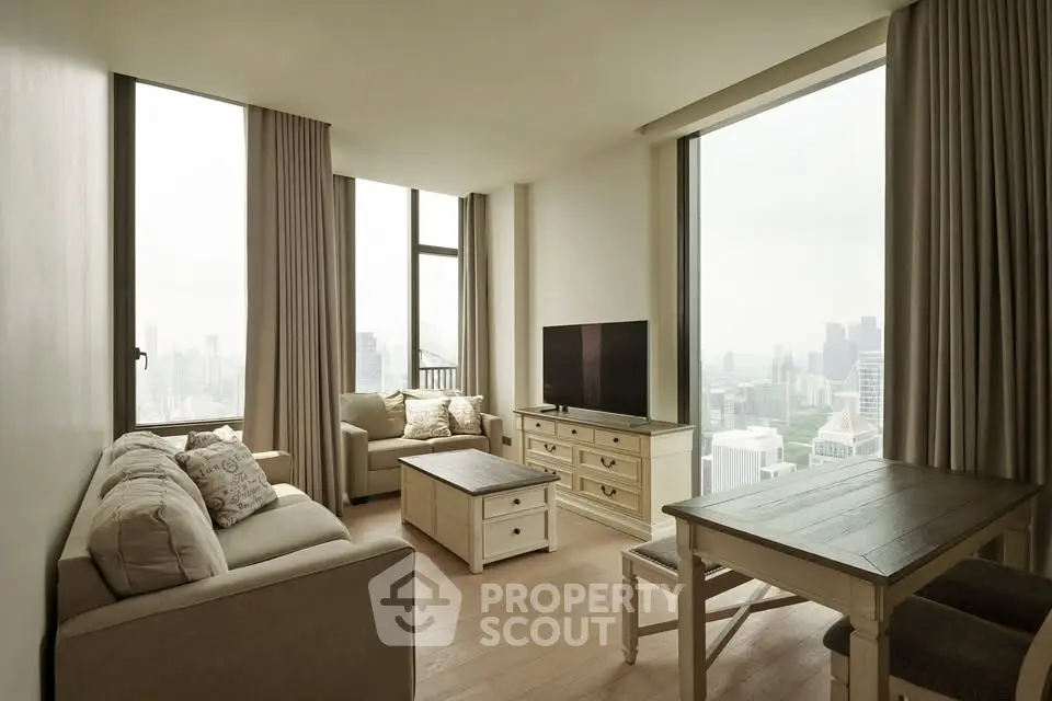 Spacious living room with panoramic city views and elegant furnishings.