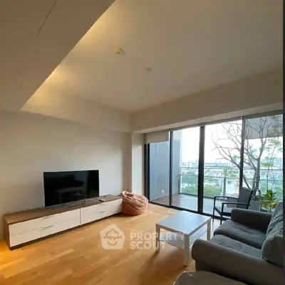 Modern living room with large windows and balcony view