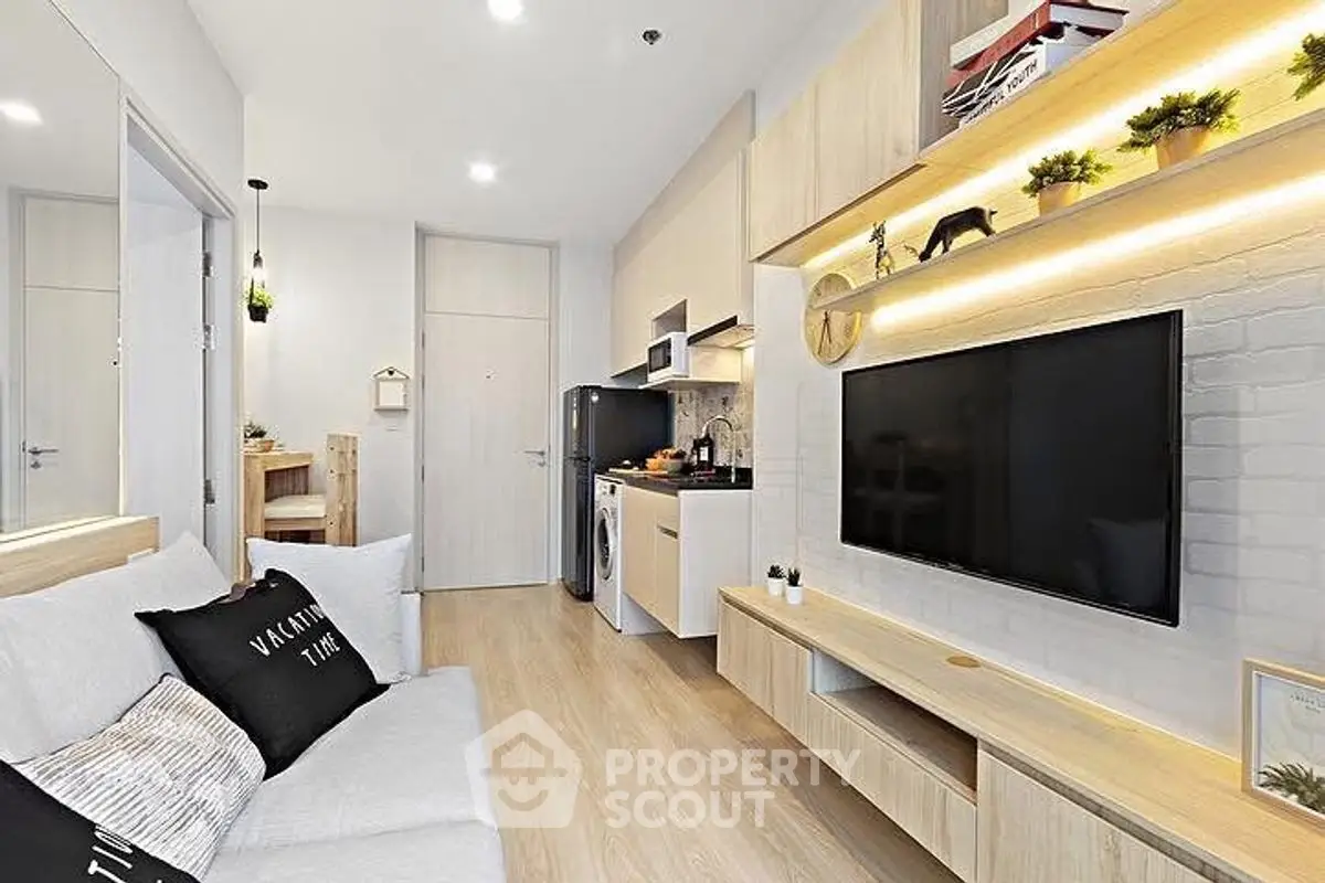 Modern living room with sleek furniture and open kitchen layout