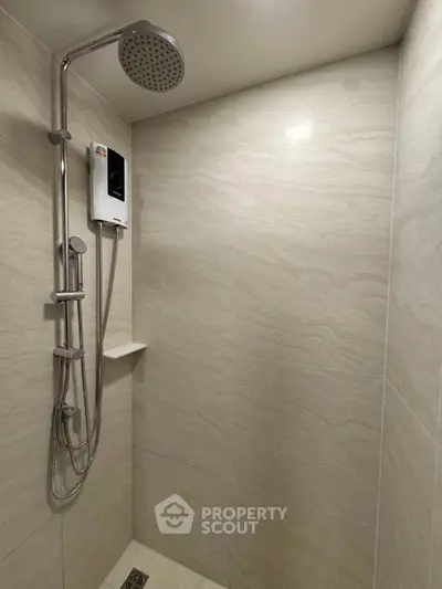 Modern bathroom with sleek shower and elegant tile design