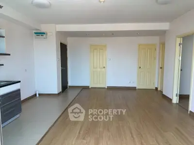 Spacious unfurnished living room with modern flooring and neutral walls