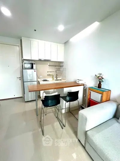 Modern kitchen with open layout and sleek design in a bright apartment