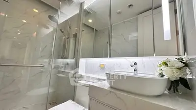 Luxurious modern bathroom with marble finishes and elegant fixtures