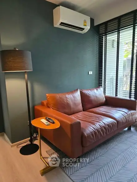 Stylish living room with leather sofa and modern decor