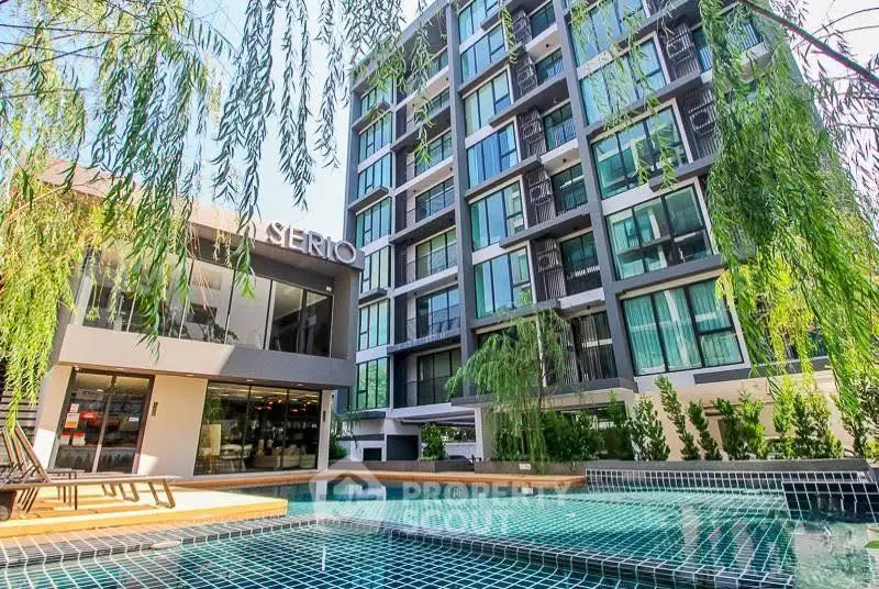 Modern condominium with pool and lush greenery, perfect for urban living.