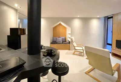 Modern living room with stylish furniture and cozy seating area, featuring sleek design and warm lighting.