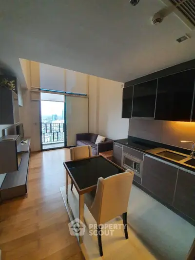 Modern living room with open kitchen and city view balcony in high-rise apartment