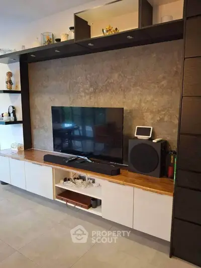 Modern living room with sleek entertainment center and stylish decor