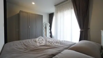 Cozy bedroom with elegant curtains and modern wardrobe