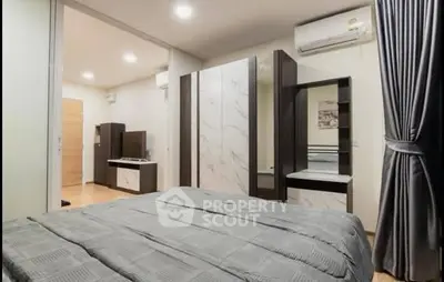 Modern bedroom with sleek furniture and air conditioning, perfect for comfort and style.