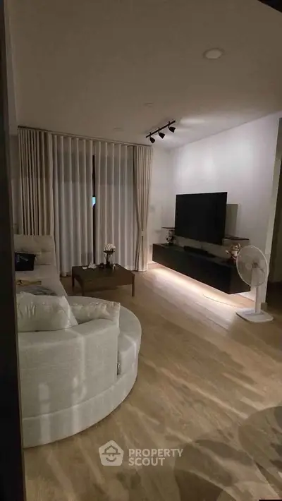 Modern living room with elegant decor and cozy seating area
