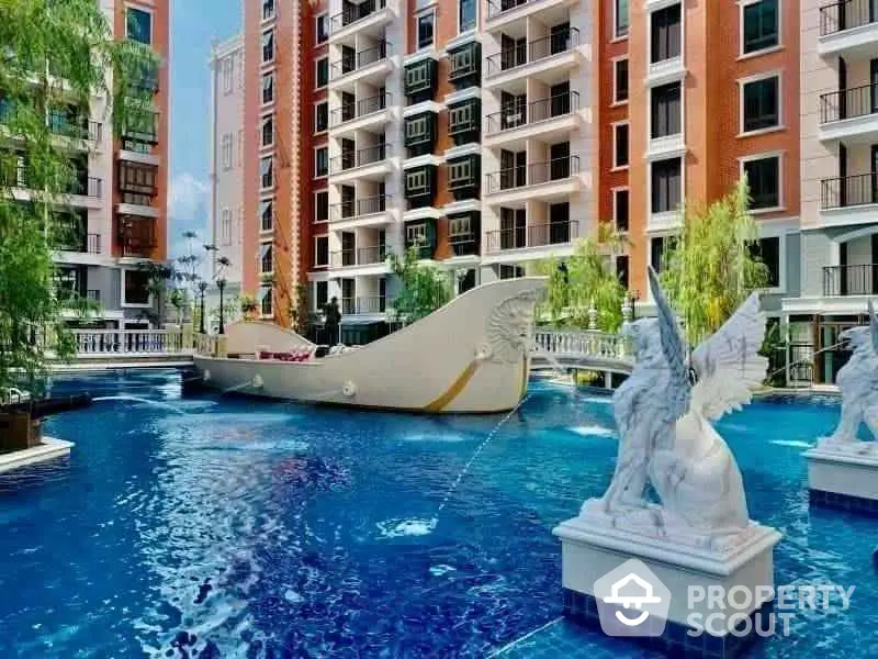 Luxurious apartment complex with stunning pool and unique boat feature