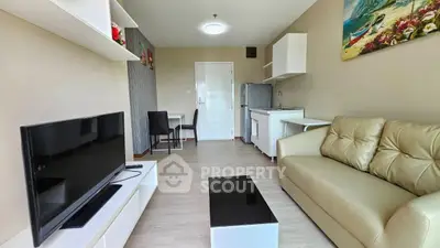 Modern living room with sleek furniture and open kitchen layout