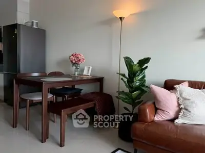 Cozy living room with elegant dining set and stylish decor, perfect for modern living.