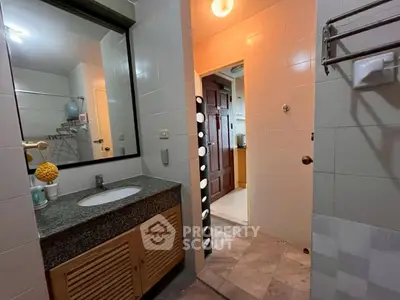 Spacious bathroom with modern fixtures and ample lighting