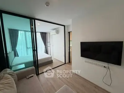 Modern apartment with glass-walled bedroom and sleek living area