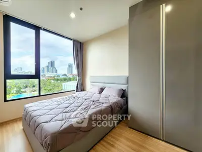 Modern bedroom with city view and sleek design