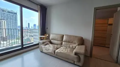 Modern living room with leather sofa and city view from large window