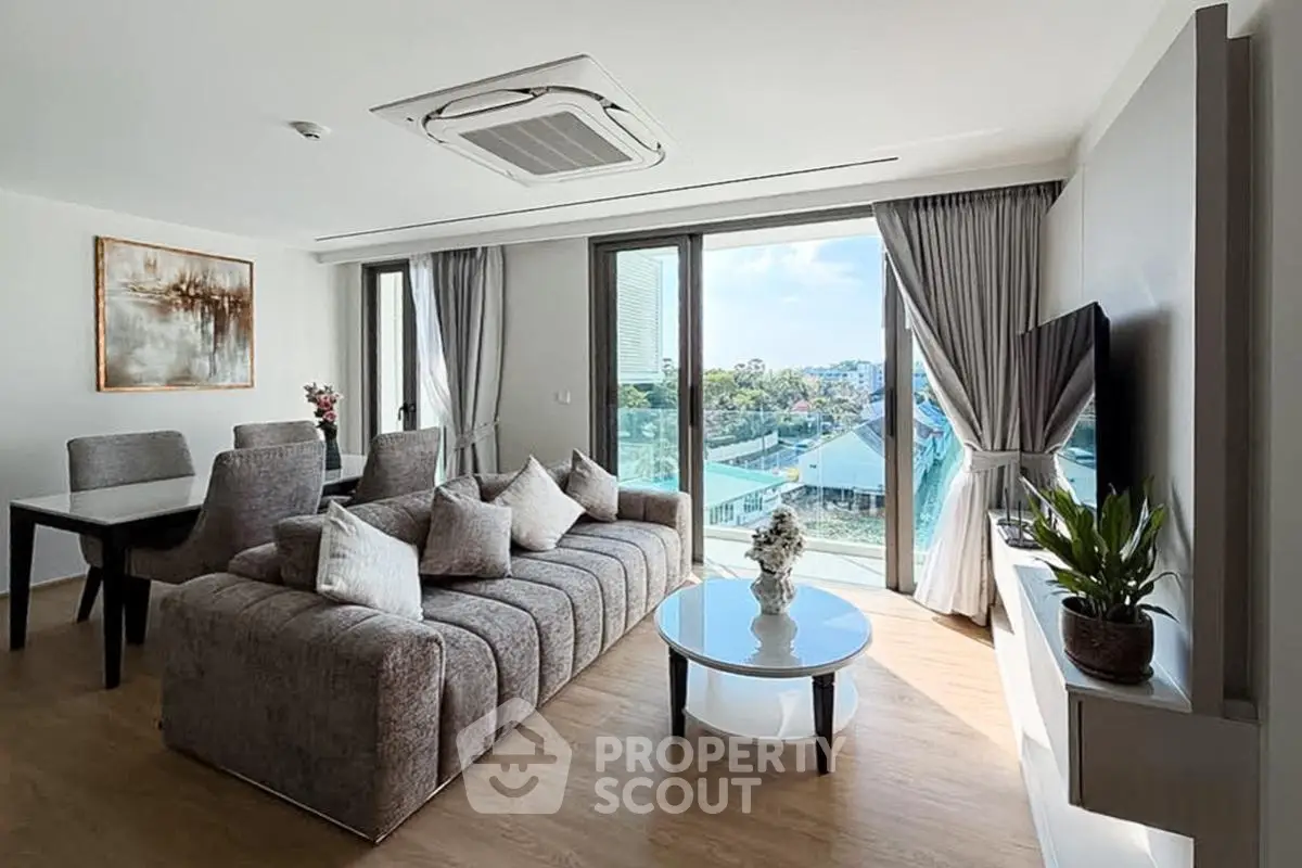 Spacious modern living room with large windows and stylish decor
