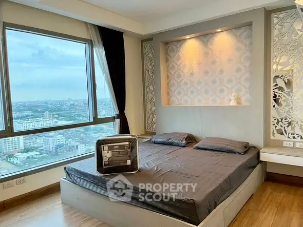 Luxurious bedroom with stunning city view and elegant decor