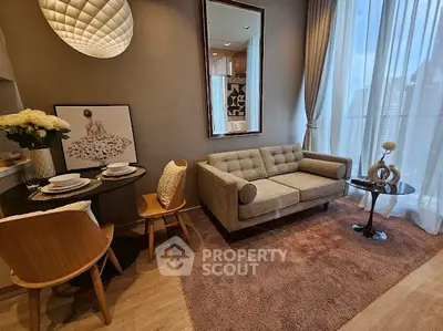 Stylish living room with modern decor and floor-to-ceiling windows offering city views.